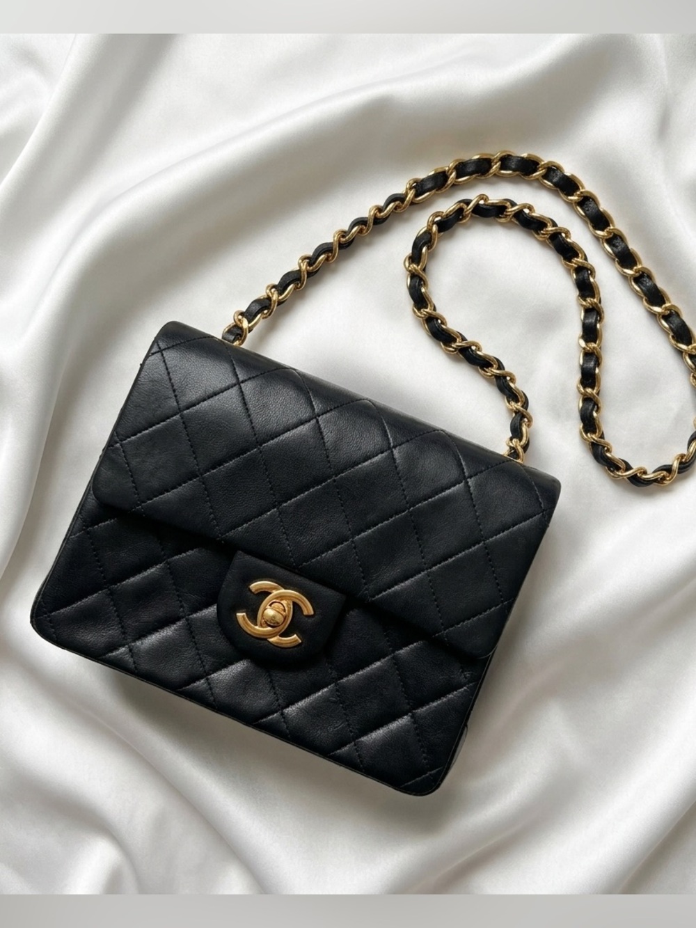 CHANEL Black Quilted Lambskin Mini Flap Crossbody with Gold Chain